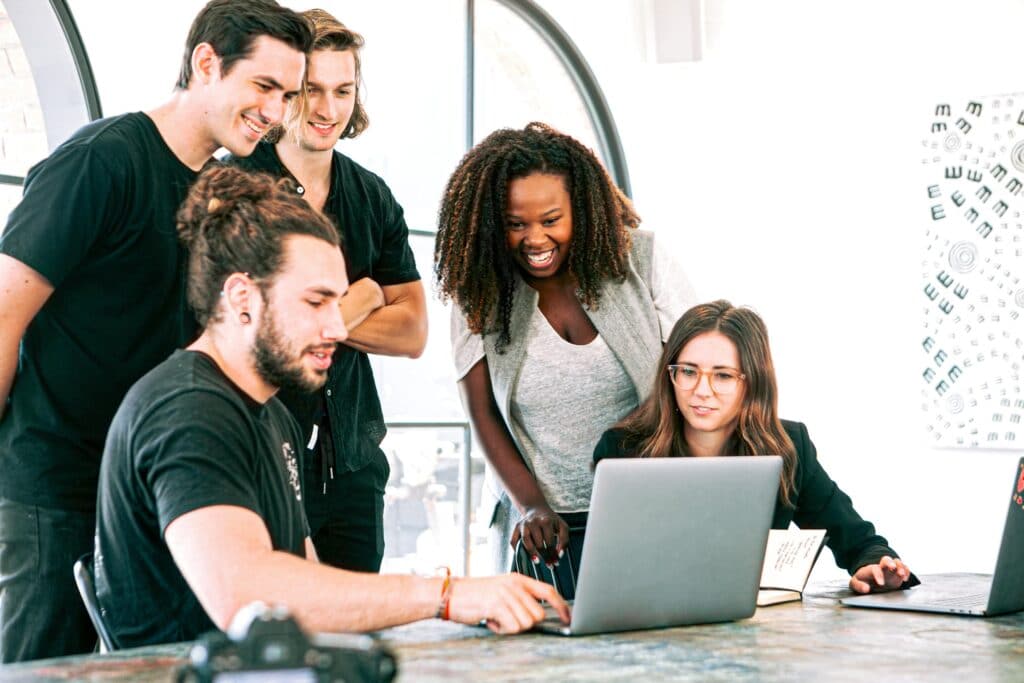 Group of vaccinated people in office working on a transformation project 